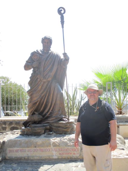 the Vicar of St Peter's in front of the Saint