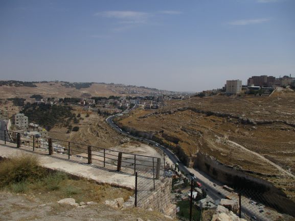 view from castle showing moabite caves on cliff front